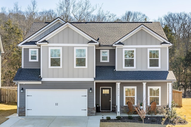 craftsman inspired home with covered porch and a garage