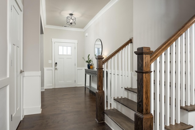 foyer featuring crown molding and dark hardwood / wood-style flooring