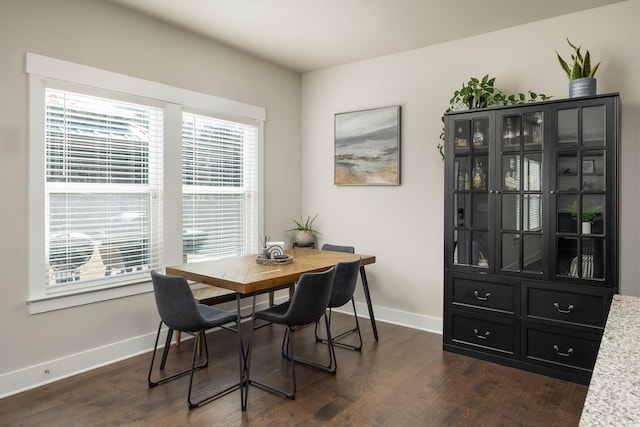 dining area featuring dark hardwood / wood-style floors