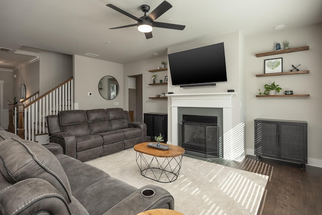 living room with dark hardwood / wood-style floors and ceiling fan