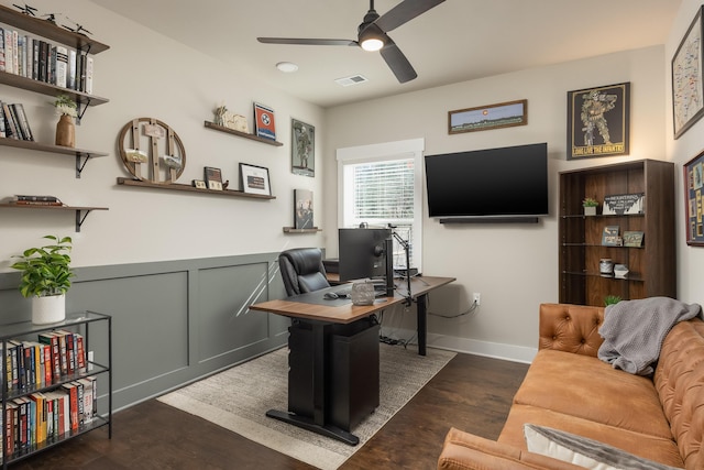 office with dark wood-type flooring and ceiling fan