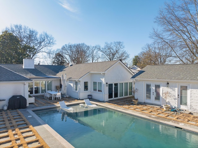 rear view of house with french doors and a patio