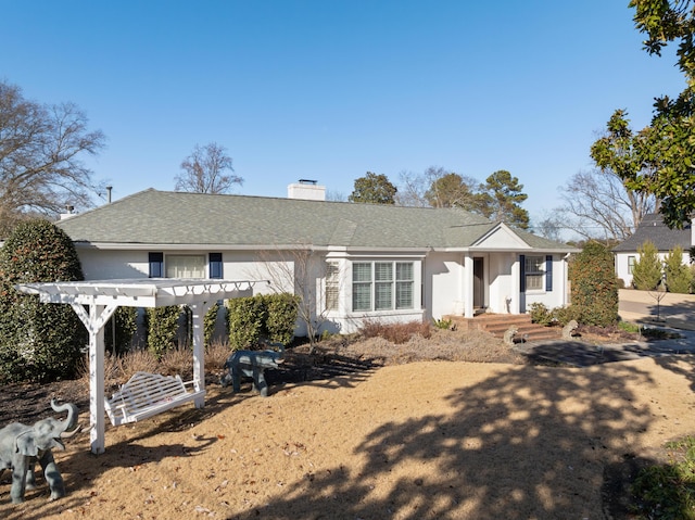 view of front of home with a pergola