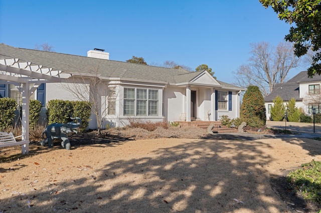 view of front of house featuring a pergola