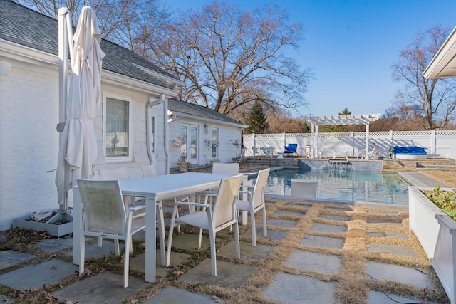 view of patio with a fenced in pool and a pergola