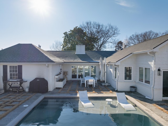 back of property with a patio area