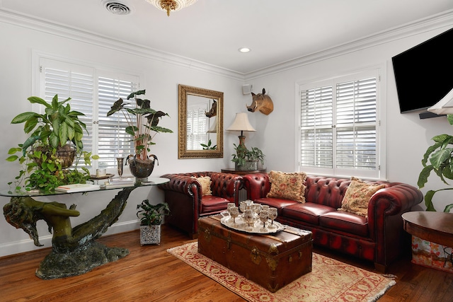 living room featuring crown molding and wood-type flooring