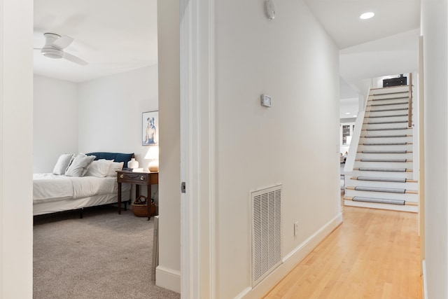 corridor with light hardwood / wood-style floors