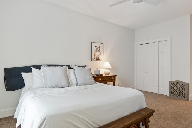 bedroom with carpet floors, ceiling fan, and a closet