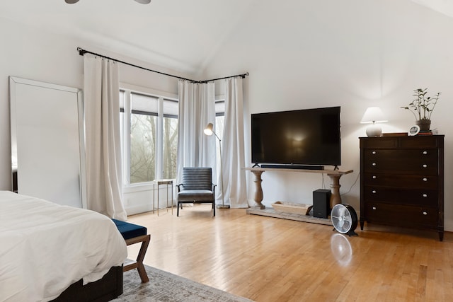 bedroom featuring vaulted ceiling and light hardwood / wood-style floors