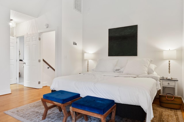 bedroom with wood-type flooring