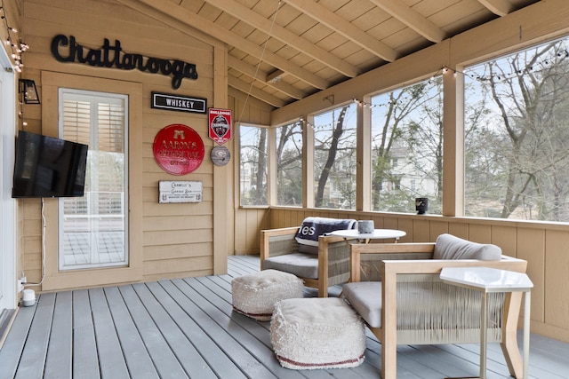 sunroom with lofted ceiling with beams and wooden ceiling