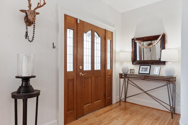 foyer entrance with light hardwood / wood-style floors