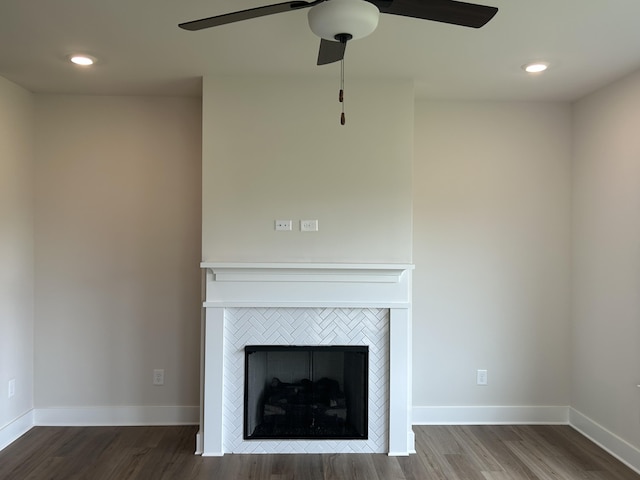 7553 Snow Cone Way Unit 17, Ooltewah, TN 37363 - detailed view of wood finished floors, a ceiling fan, a tiled fireplace, baseboards, and recessed lighting