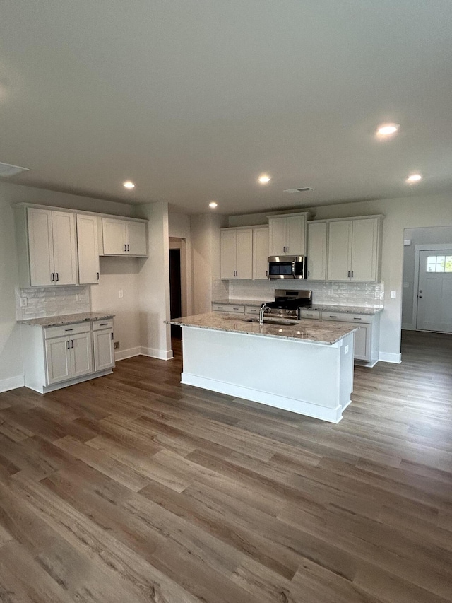 7553 Snow Cone Way Unit 17, Ooltewah, TN 37363 - kitchen featuring stainless steel appliances, baseboards, dark wood-style floors, and recessed lighting
