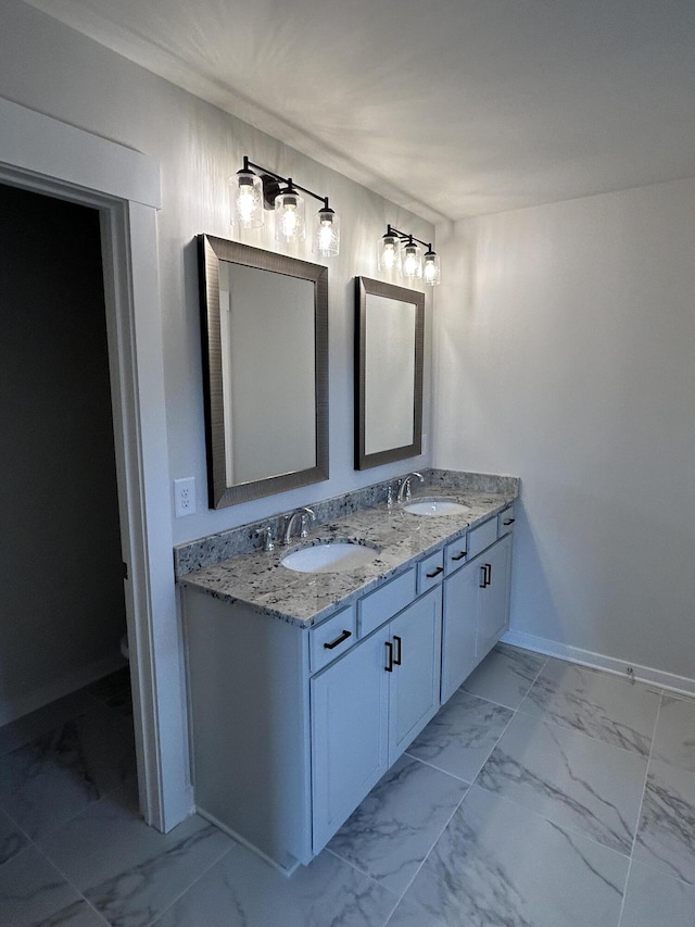 7553 Snow Cone Way Unit 17, Ooltewah, TN 37363 - bathroom featuring marble finish floors, double vanity, baseboards, and toilet