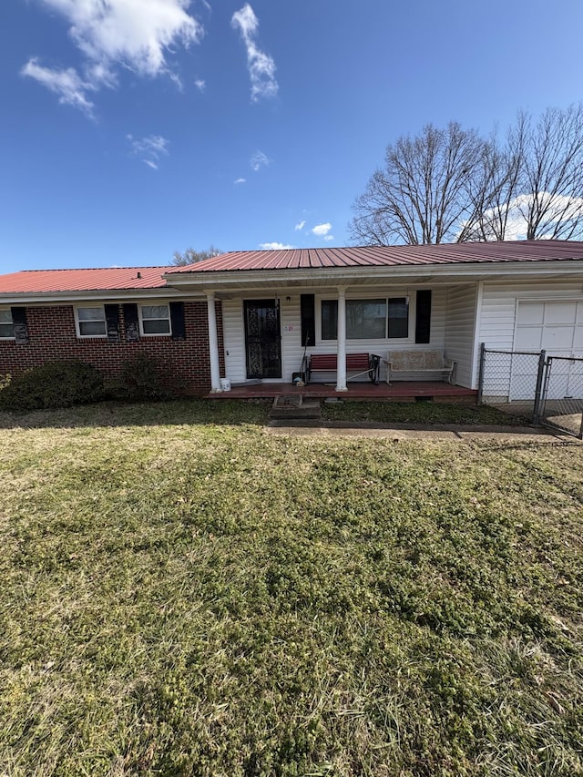 single story home with a front lawn and covered porch