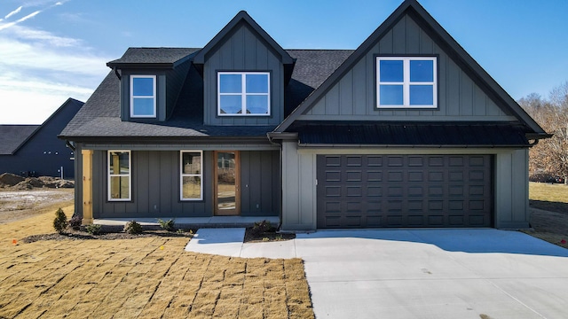 view of front of home with a garage and a porch