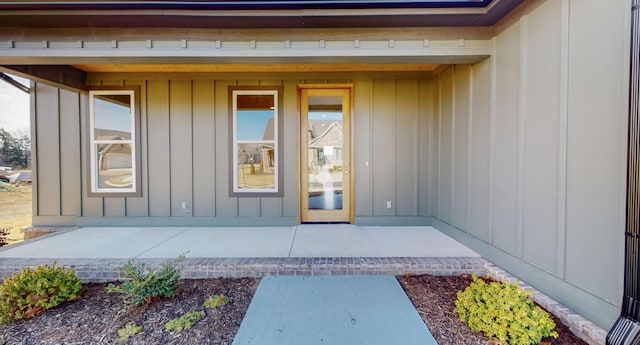 property entrance featuring a patio area