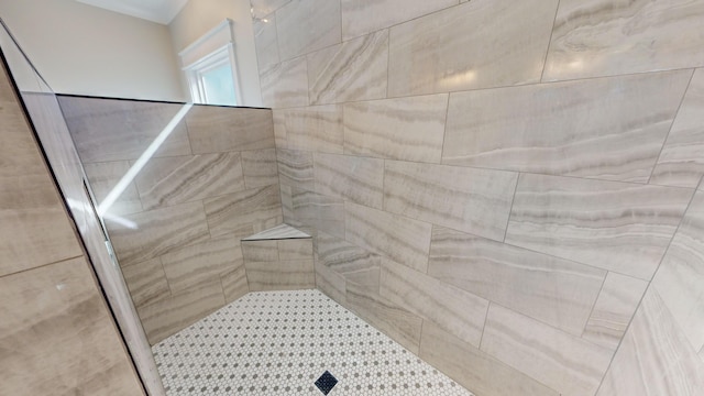 bathroom with tiled shower