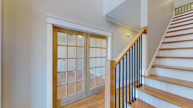 staircase with wood-type flooring