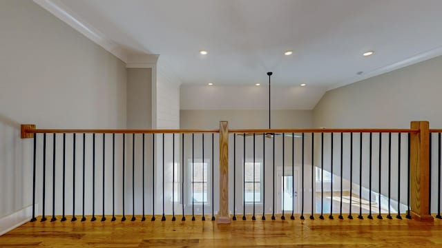 hallway with crown molding and wood-type flooring