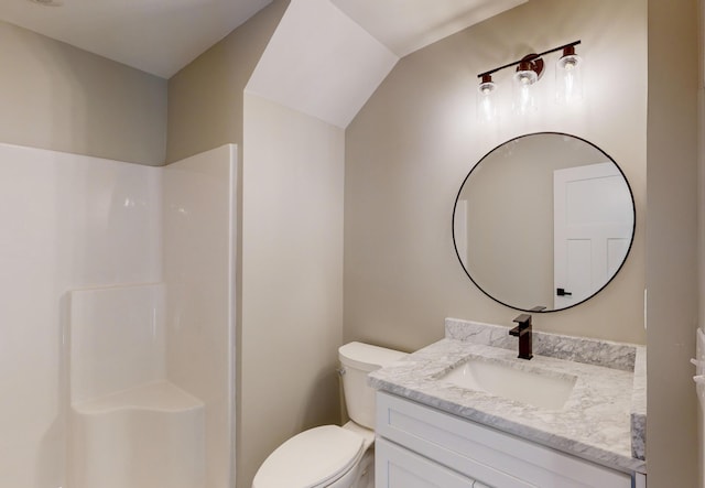 bathroom with walk in shower, vanity, and toilet