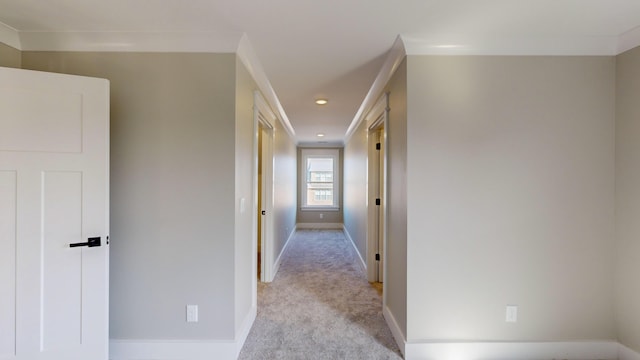 hallway featuring light carpet