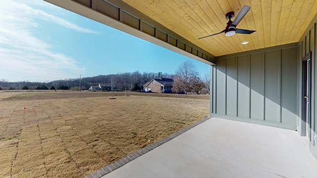 view of yard with a patio and ceiling fan