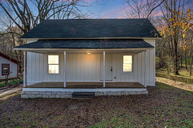 outdoor structure at dusk with a porch