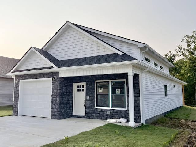 159 Rock Bridge Dr, Ringgold, GA 30736 - view of front of house featuring a garage, concrete driveway, stone siding, and a shingled roof