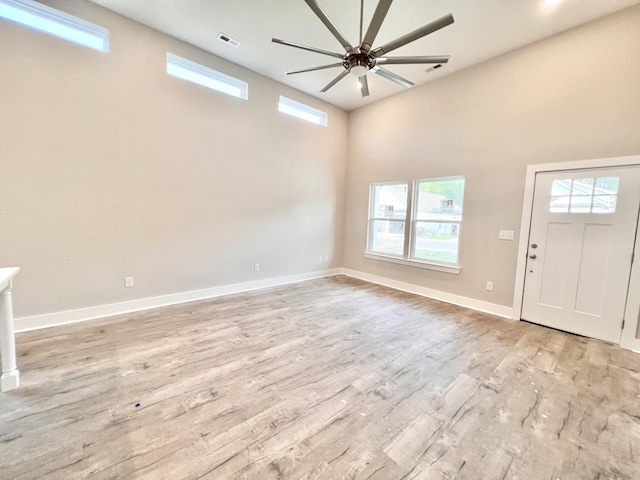 159 Rock Bridge Dr, Ringgold, GA 30736 - entryway featuring ceiling fan, plenty of natural light, light wood-type flooring, and a towering ceiling