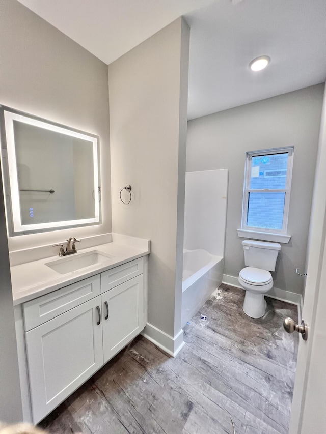 159 Rock Bridge Dr, Ringgold, GA 30736 - bathroom featuring toilet, wood finished floors, vanity, and baseboards