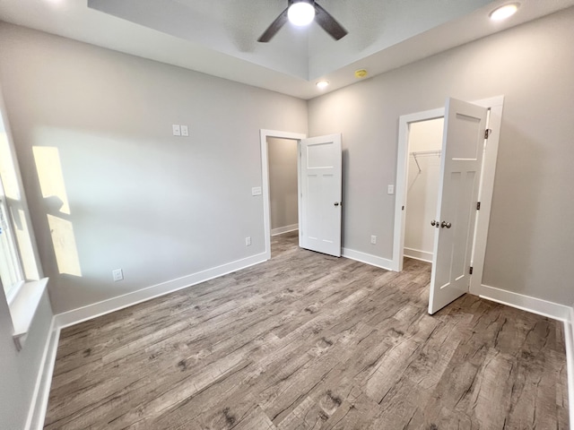 159 Rock Bridge Dr, Ringgold, GA 30736 - unfurnished bedroom with wood finished floors, a spacious closet, a closet, recessed lighting, and a ceiling fan