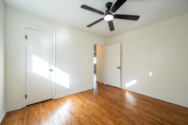 unfurnished bedroom featuring ceiling fan and light hardwood / wood-style floors