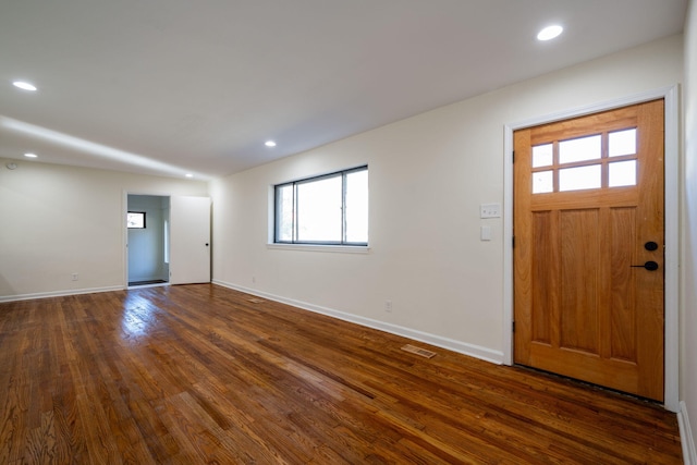 entryway with dark wood-type flooring