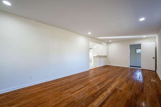 unfurnished room with hardwood / wood-style floors