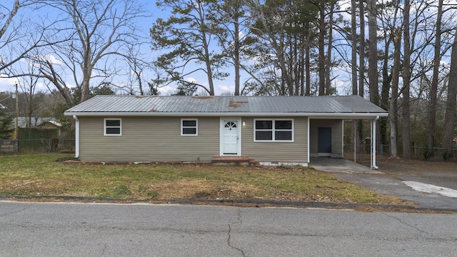 ranch-style house with a front lawn and a carport