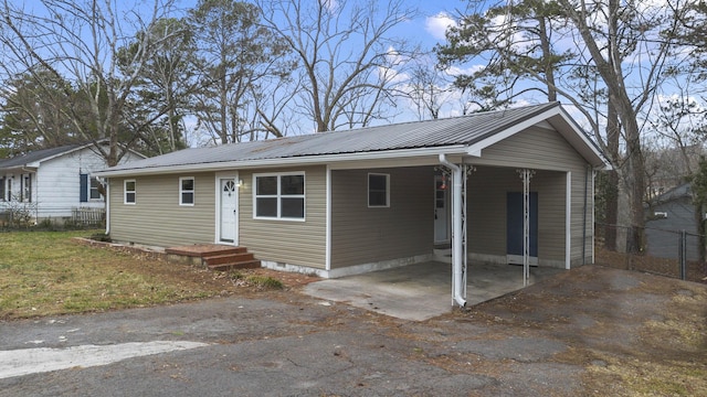 view of front facade with a carport