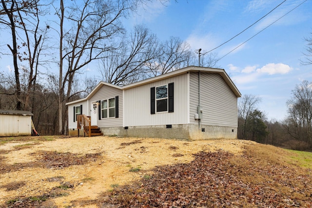 exterior space featuring a shed