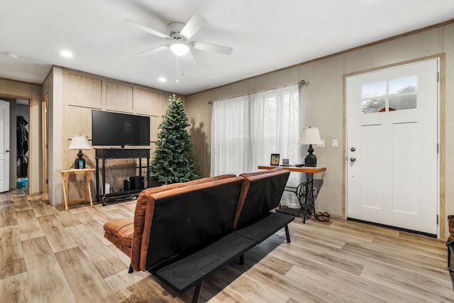 living room with ceiling fan, light hardwood / wood-style flooring, and a healthy amount of sunlight