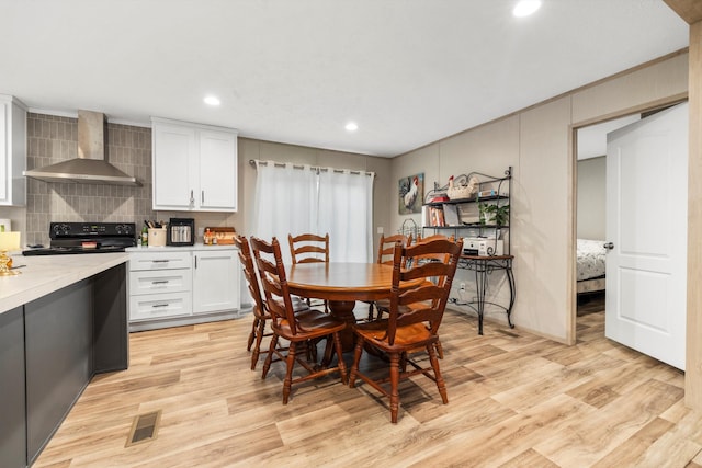 dining room featuring light hardwood / wood-style flooring