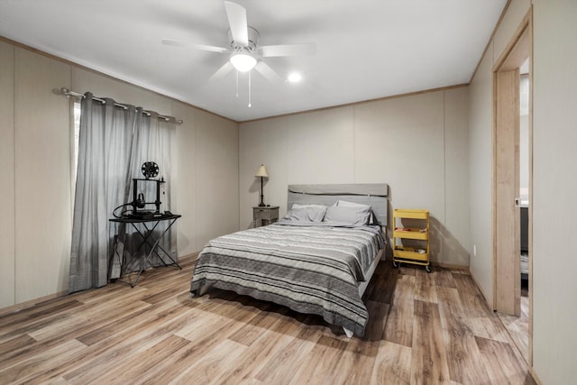 bedroom with ceiling fan and light hardwood / wood-style flooring