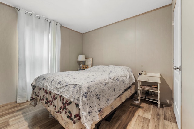 bedroom with light hardwood / wood-style floors