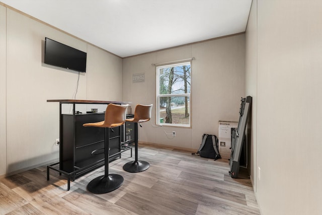 office featuring ornamental molding and light wood-type flooring