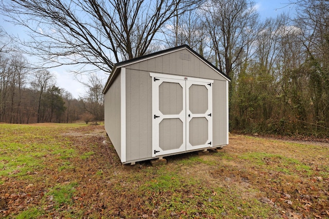 view of outdoor structure with a lawn