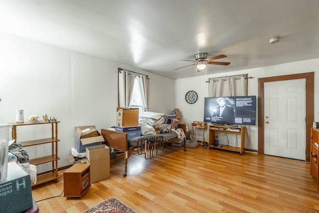 sitting room featuring ceiling fan and light wood-type flooring