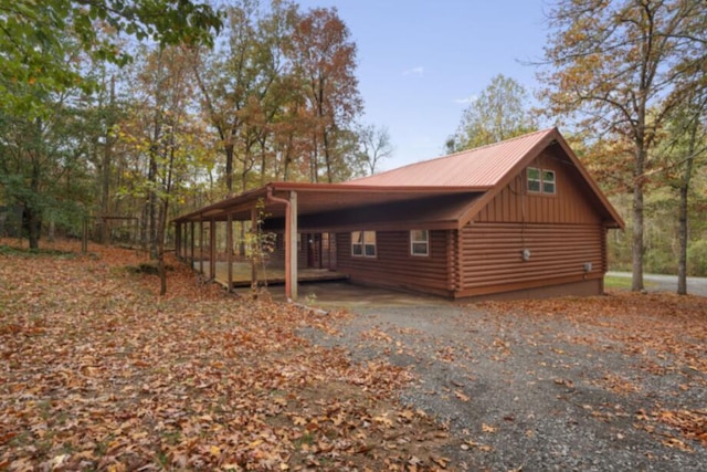 view of side of property featuring a carport