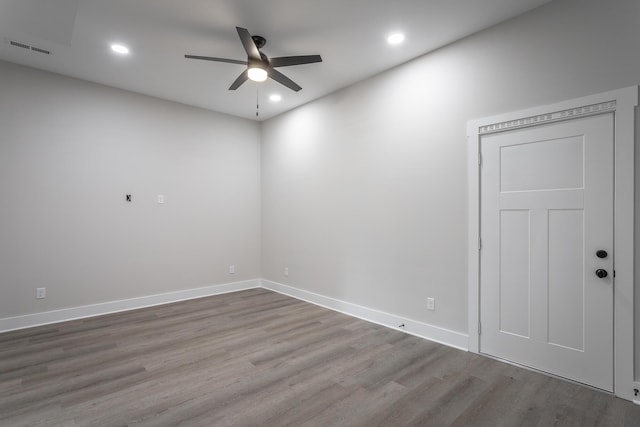 empty room with light hardwood / wood-style flooring and ceiling fan