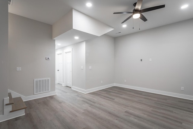 empty room featuring hardwood / wood-style floors and ceiling fan